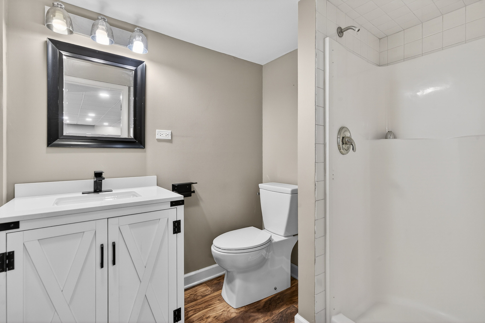 38-w042 Silver Glen Road St. Charles, IL 60175 - Photo 31 of 40 a bathroom with a toilet a sink and mirror