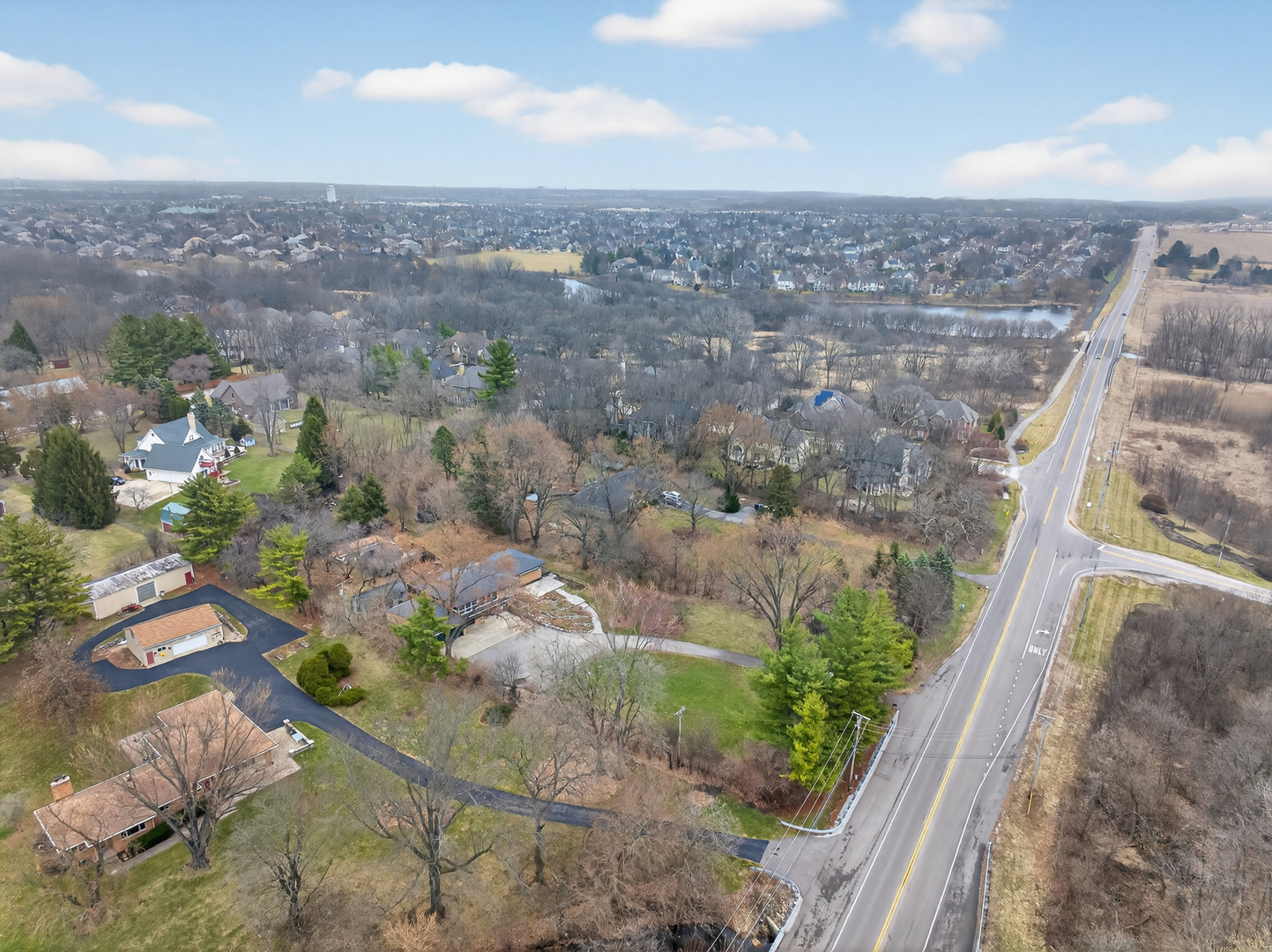 38-w042 Silver Glen Road St. Charles, IL 60175 - Photo 36 of 40 an aerial view of a house with a yard and mountain view in back