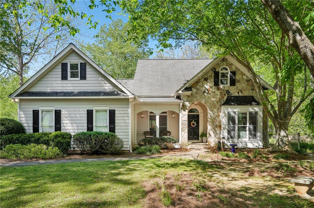 a front view of a house with a yard