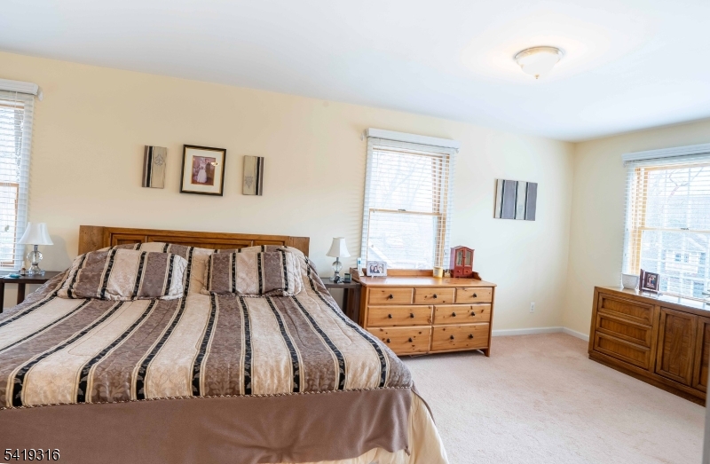 2 Lilac Road Lake Hopatcong, NJ 07849 - Photo 15 of 34 a bed room with two bed and a dresser