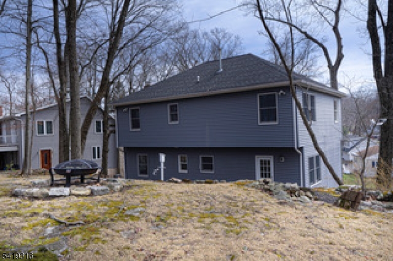 2 Lilac Road Lake Hopatcong, NJ 07849 - Photo 26 of 34 a brick house with a yard and large tree
