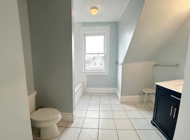 a bathroom with a sink vanity and a mirror