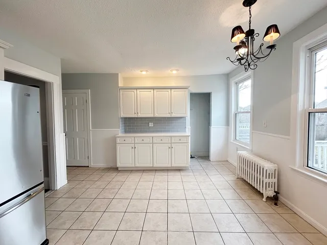 a kitchen with stainless steel appliances granite countertop a sink and a stove