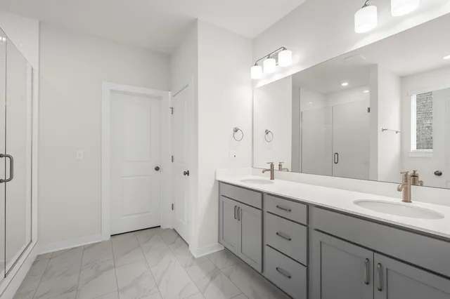 a bathroom with a bathtub and a shower