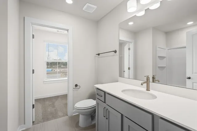 a view of a patio with couches and potted plants with sky view