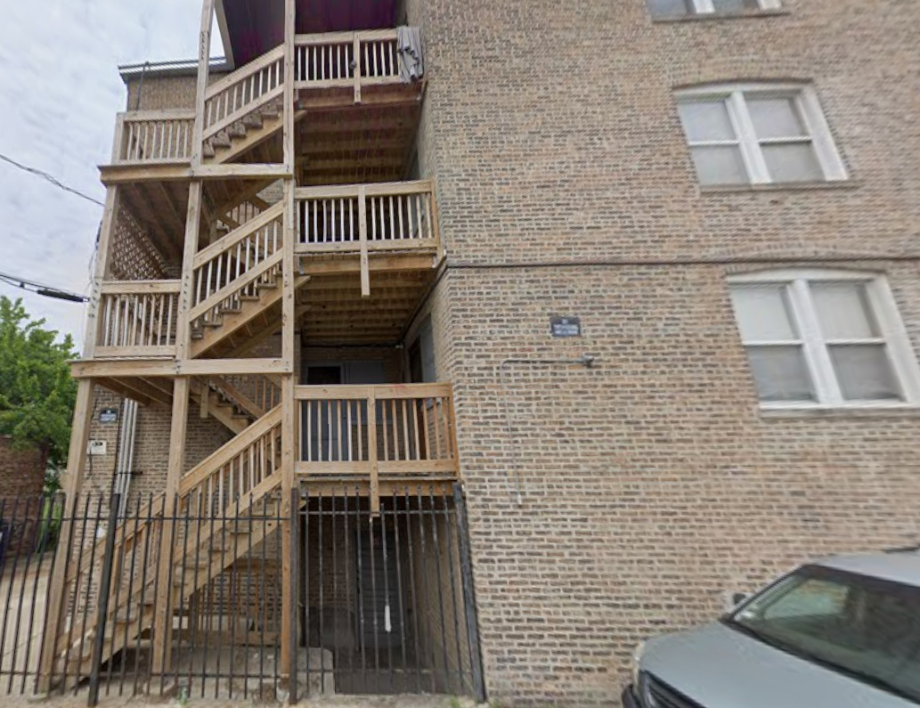 7031 South Indiana Avenue, Unit 3W Chicago, IL 60637 - Photo 1 of 1 a balcony with a door