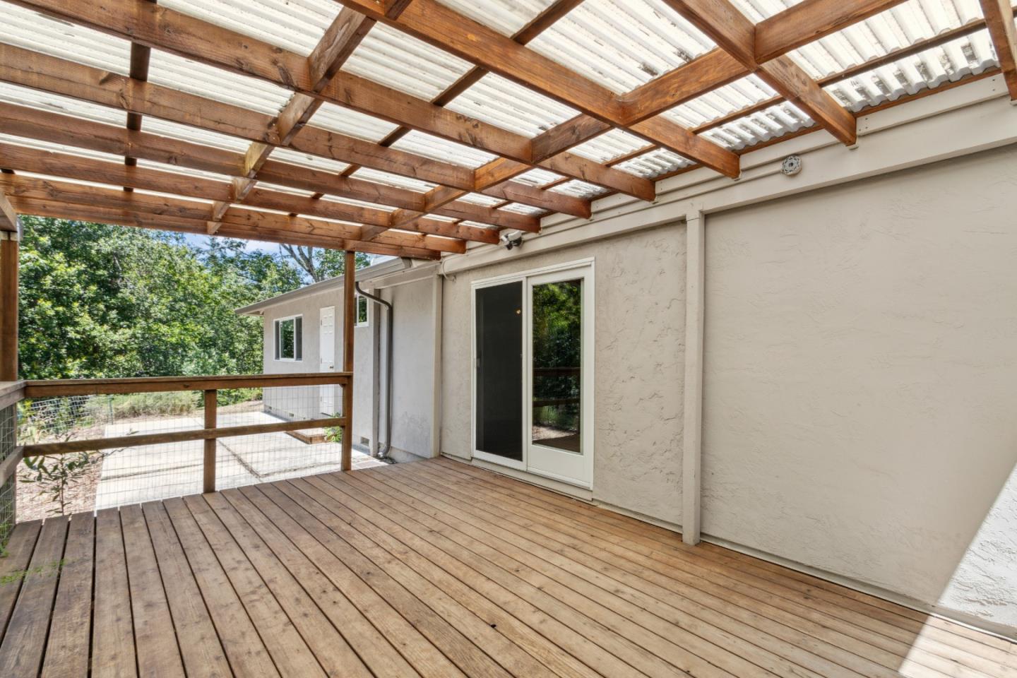 24895 Skyland Road Los Gatos, CA 95033 - Photo 46 of 113 a view of a porch with wooden floor and brick walls