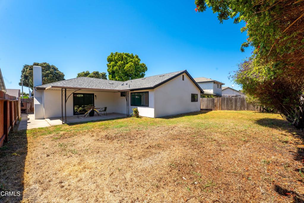 930 Topsail Court Oxnard, CA 93035 - Photo 14 of 31 a front view of house with yard and trees in the background