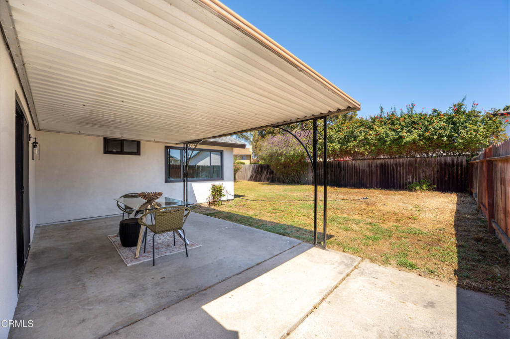 930 Topsail Court Oxnard, CA 93035 - Photo 16 of 31 a backyard of a house with table and chairs