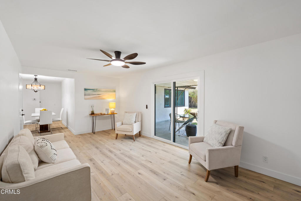 930 Topsail Court Oxnard, CA 93035 - Photo 20 of 31 a living room with furniture and a wooden floor