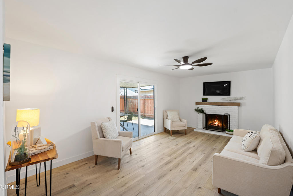 930 Topsail Court Oxnard, CA 93035 - Photo 21 of 31 a living room with furniture and a fireplace