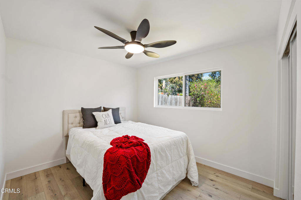 930 Topsail Court Oxnard, CA 93035 - Photo 27 of 31 a bedroom with a bed and a window