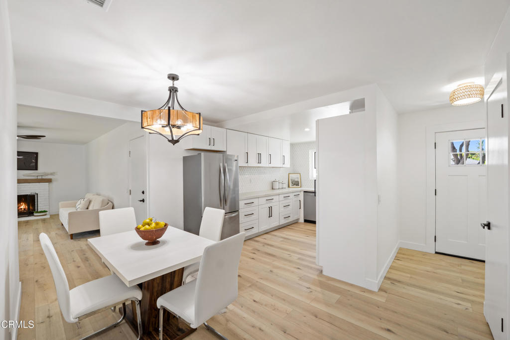 930 Topsail Court Oxnard, CA 93035 - Photo 8 of 31 a view of a dining room with furniture and wooden floor
