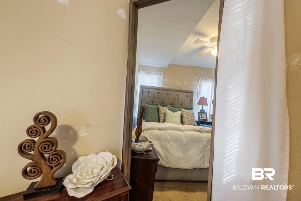 109 Esplanade Avenue Mobile, AL 36606 - Photo 22 of 45 Bedroom featuring a ceiling fan and carpet flooring