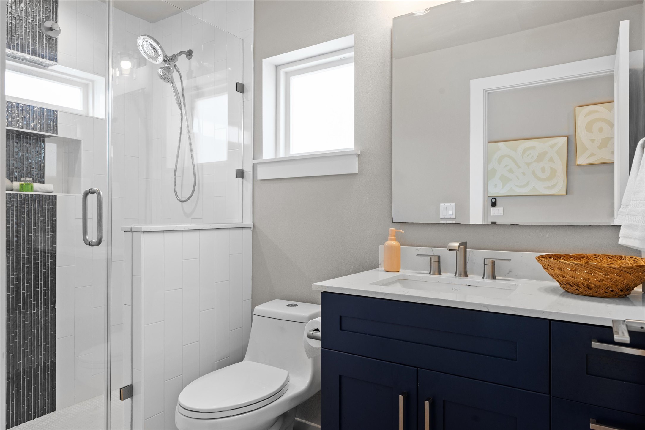 1116 Stobaugh Street, Unit B Austin, TX 78757 - Photo 8 of 38 The clean, modern palette gives the primary bathroom a spa-like feel.