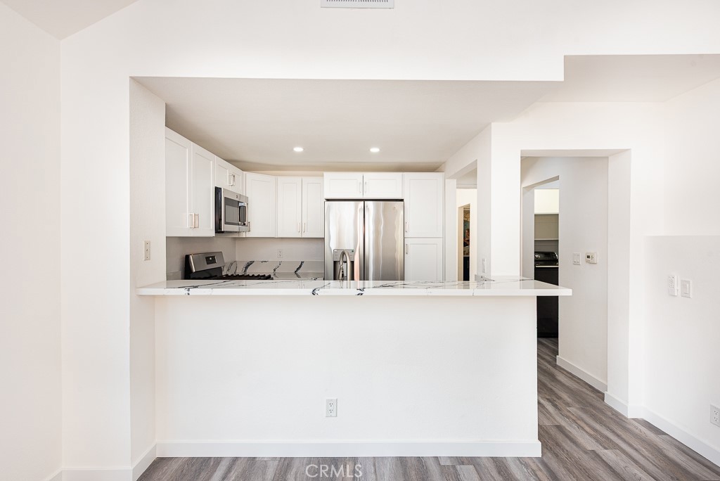 4240 Lost Hills Road, Unit 3108 Calabasas, CA 91301 - Photo 12 of 28 a view of kitchen with stainless steel appliances granite countertop refrigerator sink and stove