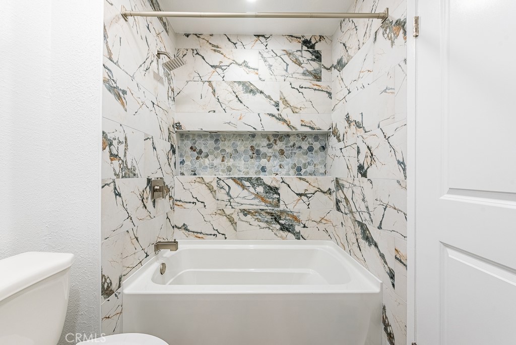 4240 Lost Hills Road, Unit 3108 Calabasas, CA 91301 - Photo 18 of 28 a bathroom with a bathtub and shower