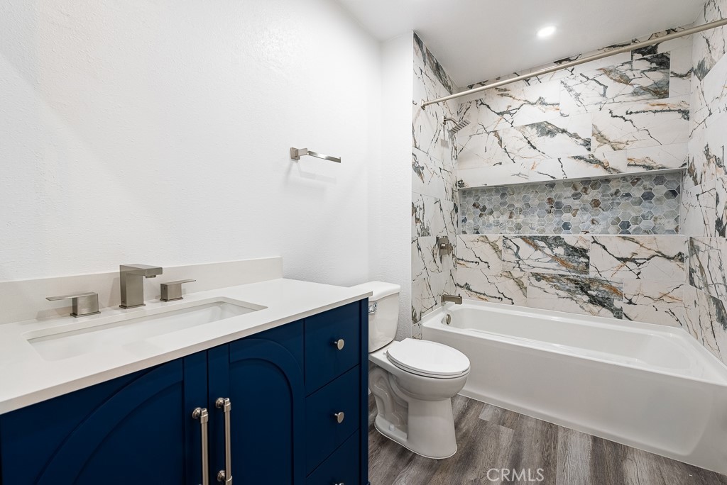 4240 Lost Hills Road, Unit 3108 Calabasas, CA 91301 - Photo 19 of 28 a bathroom with a sink toilet and shower