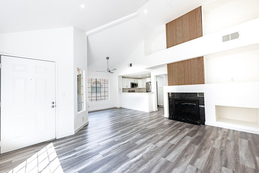 4240 Lost Hills Road, Unit 3108 Calabasas, CA 91301 - Photo 7 of 28 a view of an empty room with a fireplace and a window
