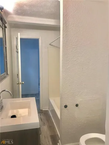 a bathroom with a sink and mirror