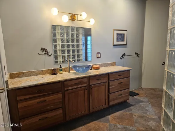 a bathroom with a double vanity sink and a mirror