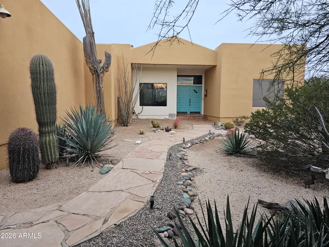 a view of a entryway with flower plants
