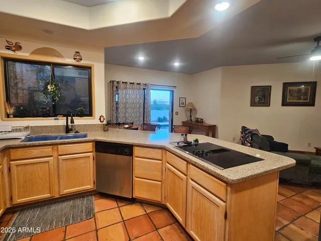 a kitchen that has a sink and a stove in it