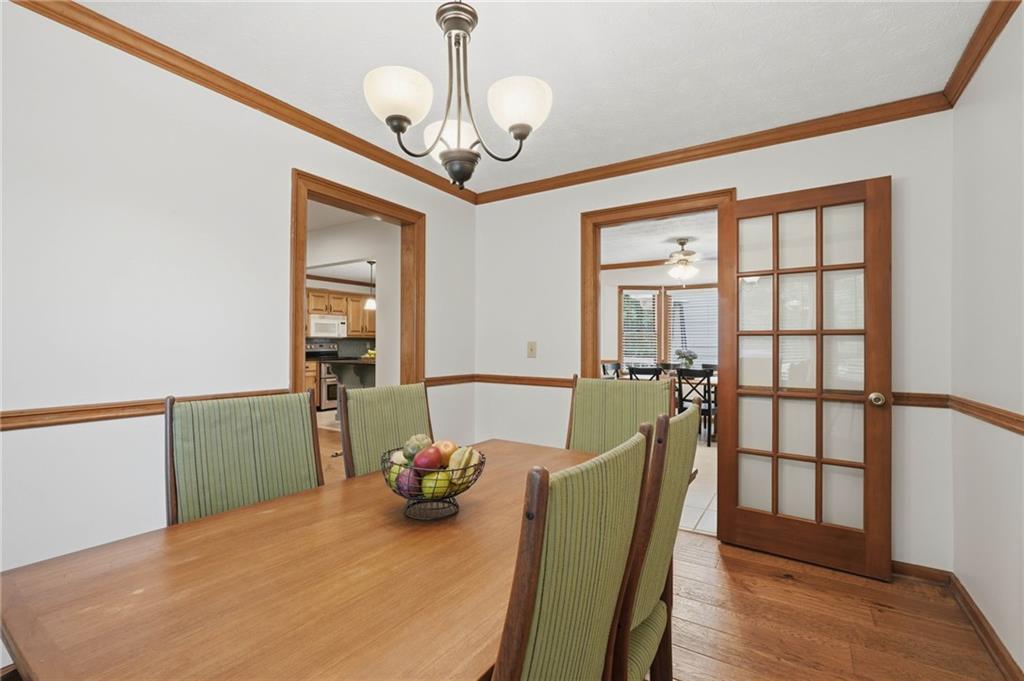 4891 Bill Cheek Road Auburn, GA 30011 - Photo 15 of 99 a view of a dining room with furniture window and wooden floor