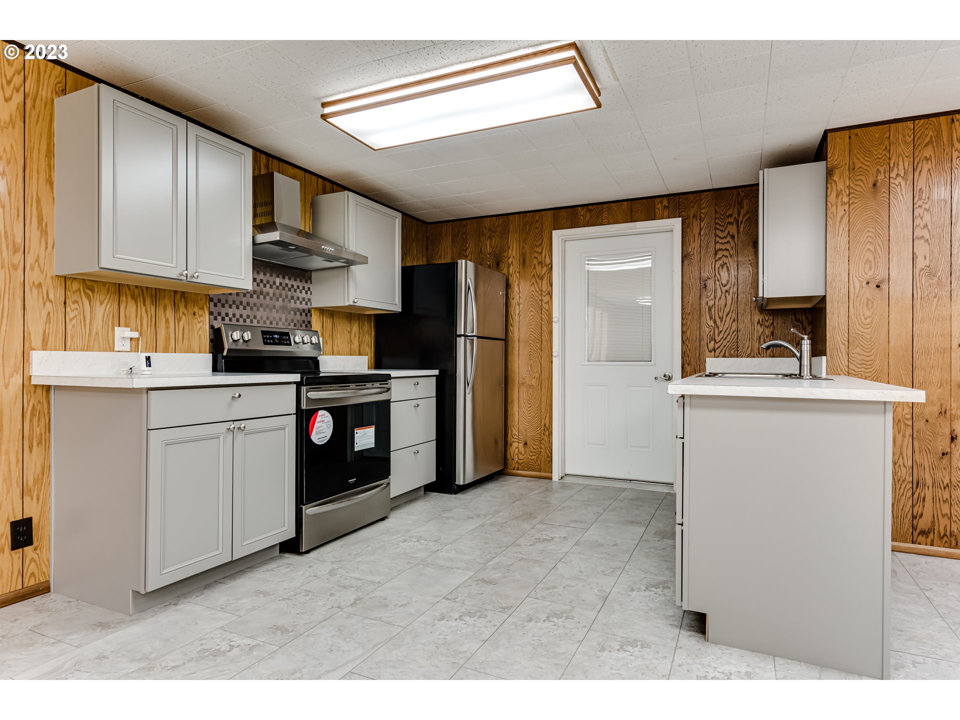 88240 Millican Road Springfield, OR 97478 - Photo 4 of 15 a kitchen with a sink cabinets stainless steel appliances and a window