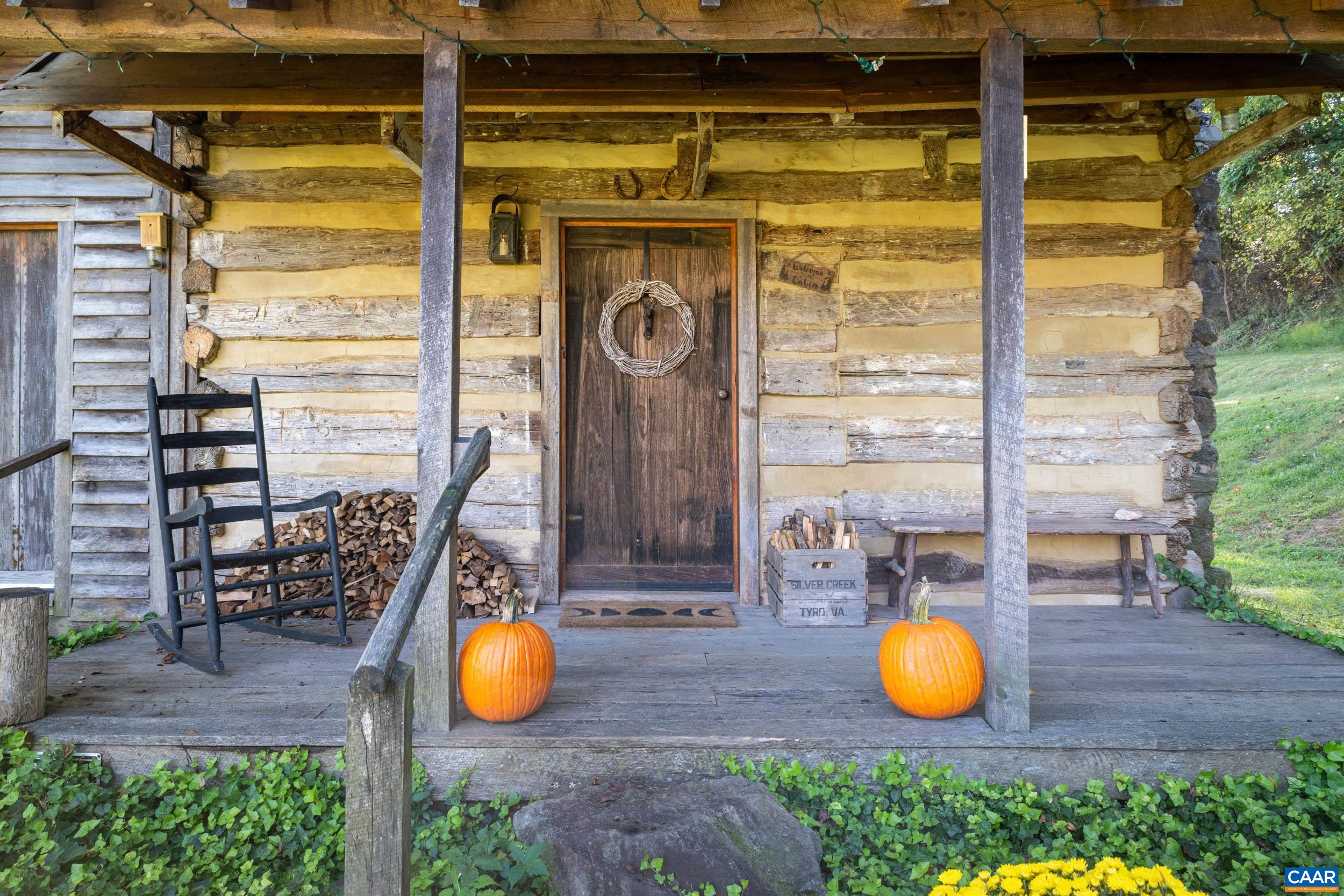 4925 Crabtree Falls Highway Tyro, VA 22976 - Photo 11 of 48 a view of a wooden floor with a chair and a potted plant