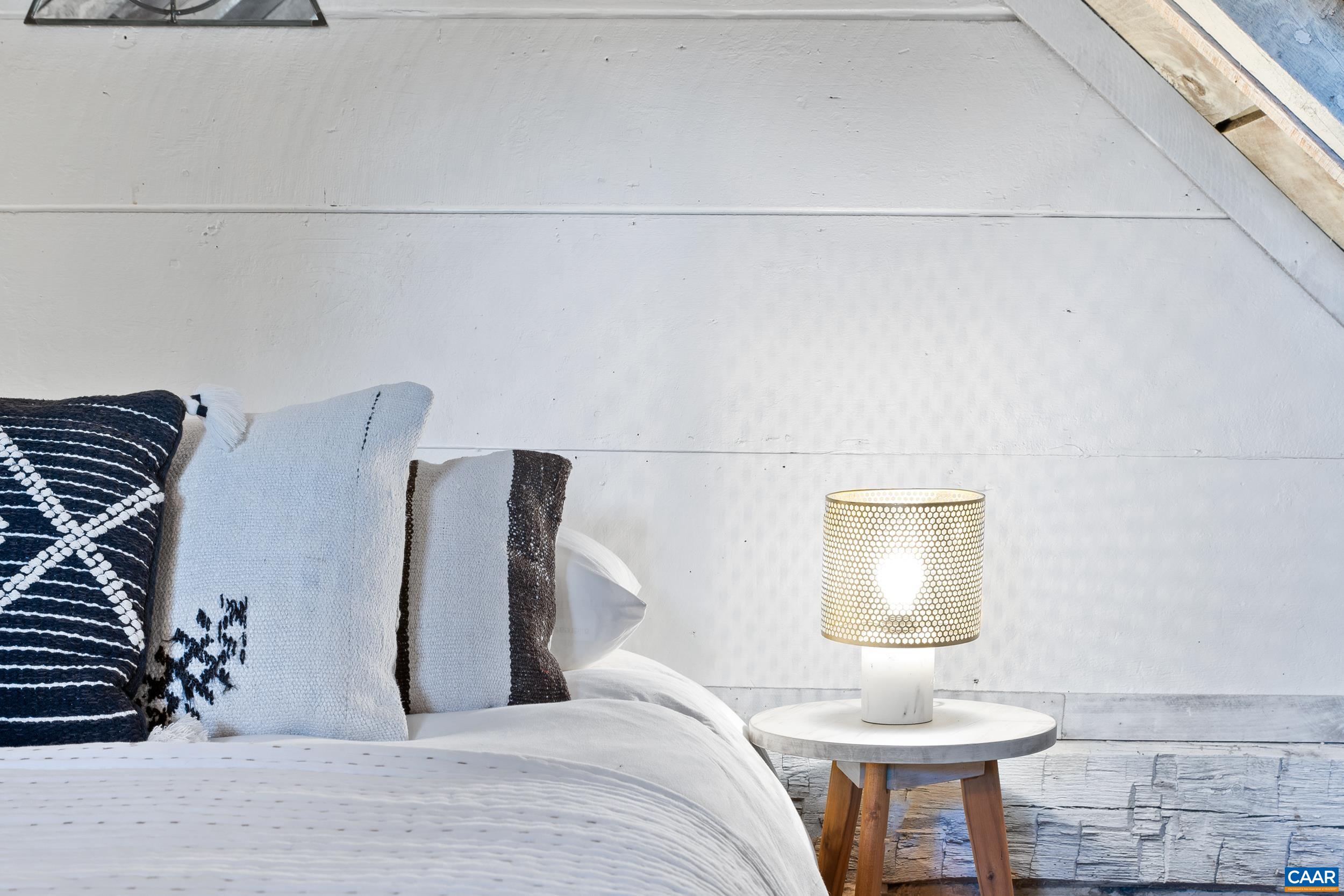 4925 Crabtree Falls Highway Tyro, VA 22976 - Photo 18 of 48 a bedroom with a bed and a lamp