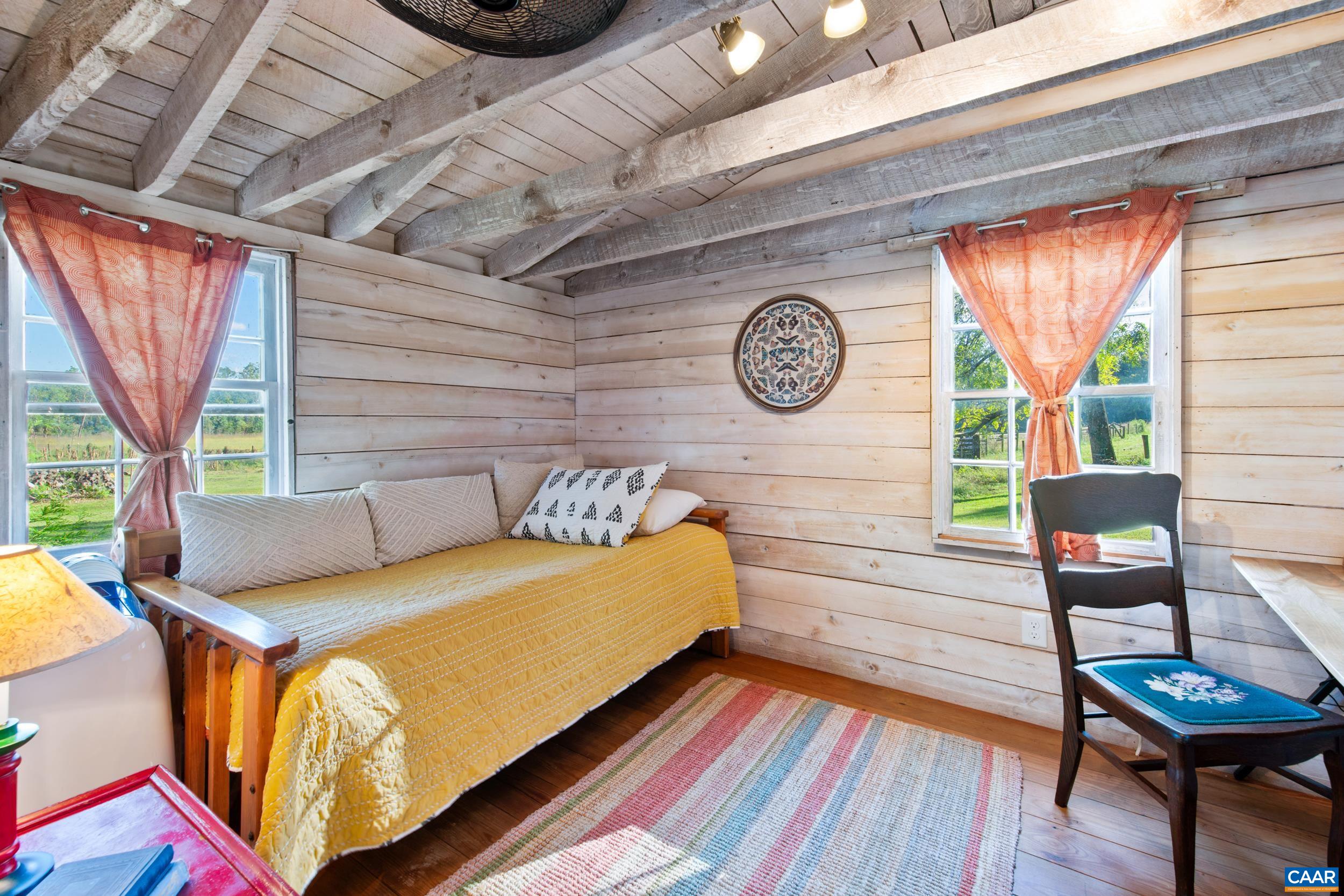 4925 Crabtree Falls Highway Tyro, VA 22976 - Photo 21 of 48 a bedroom with a bed and a chair