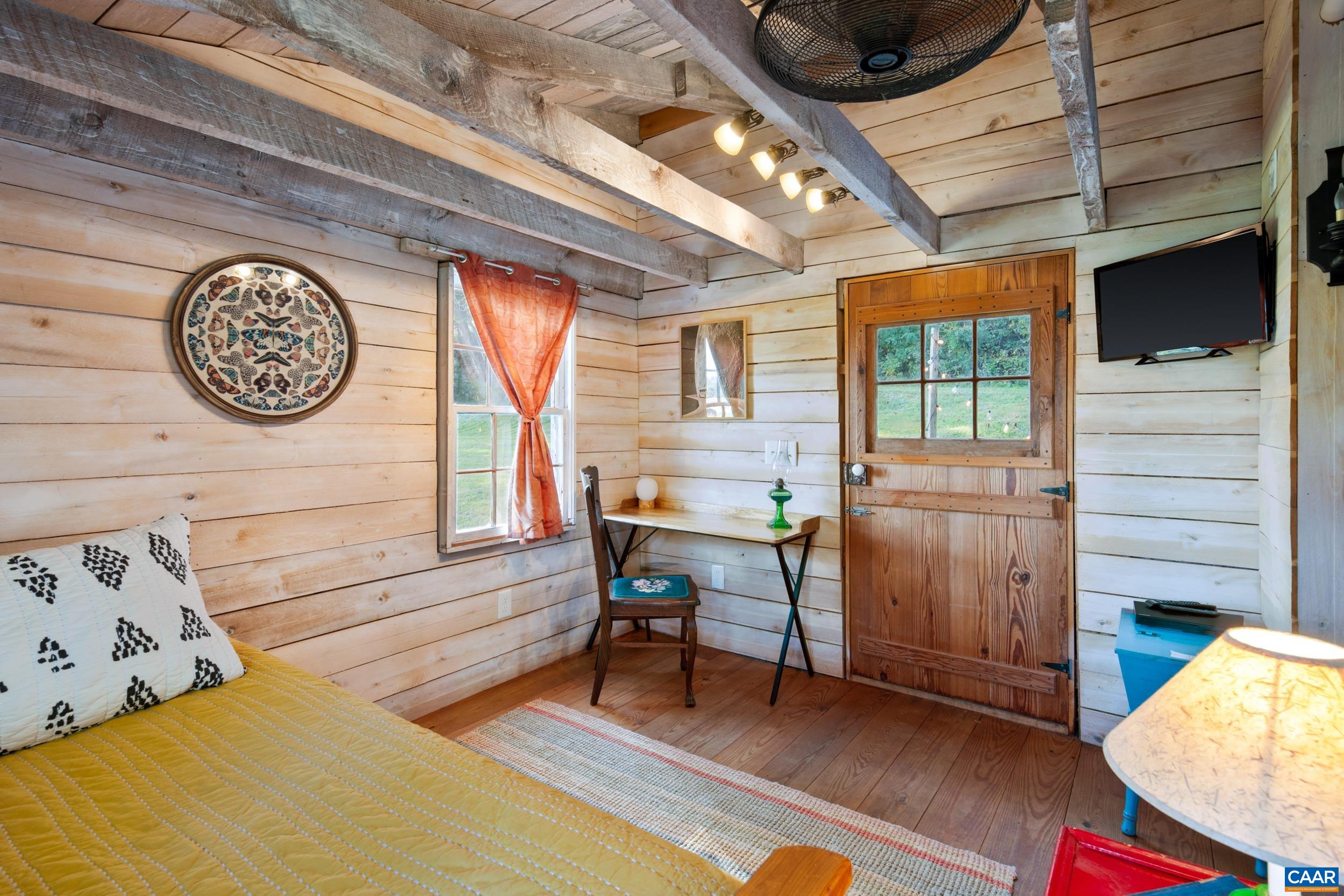 4925 Crabtree Falls Highway Tyro, VA 22976 - Photo 22 of 48 a view of a room with furniture and a window