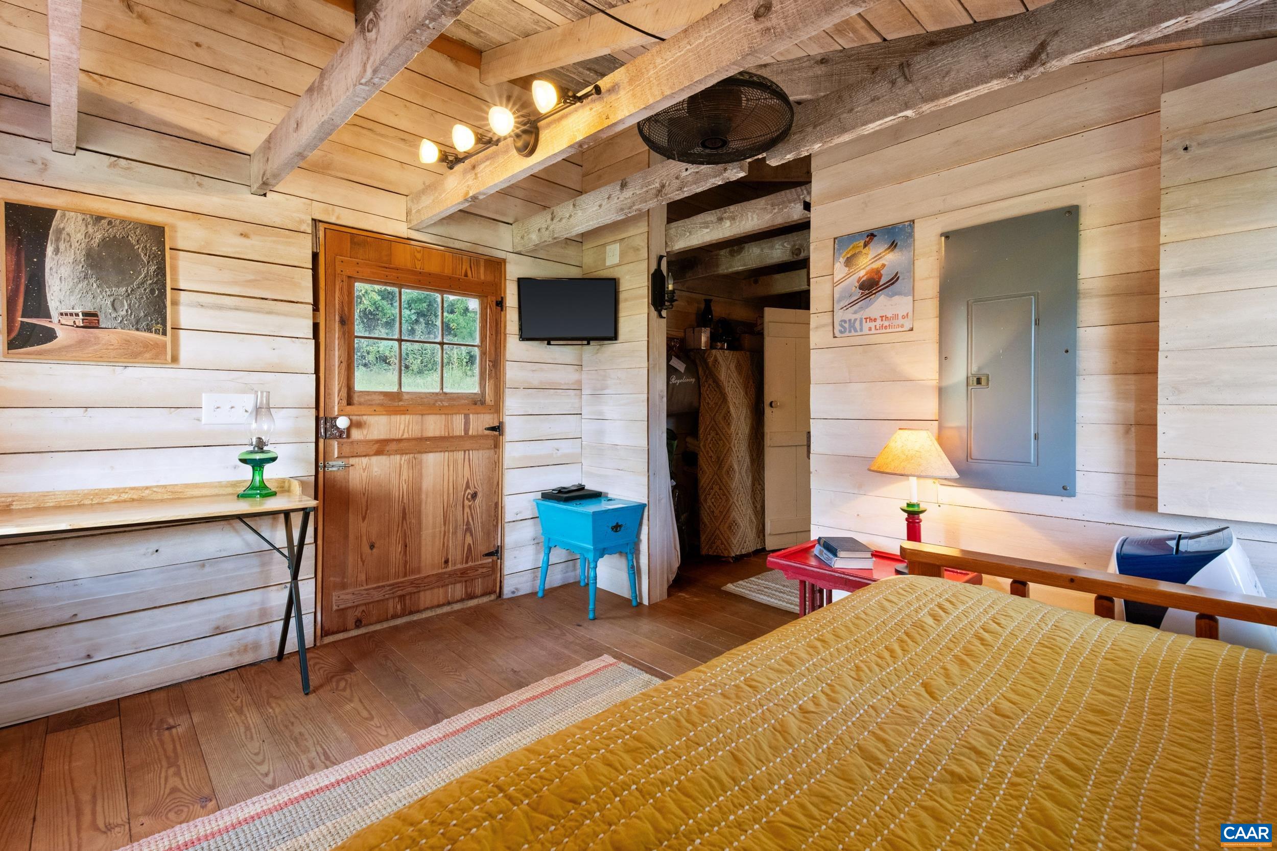 4925 Crabtree Falls Highway Tyro, VA 22976 - Photo 26 of 48 a bed room with a bed and a dresser