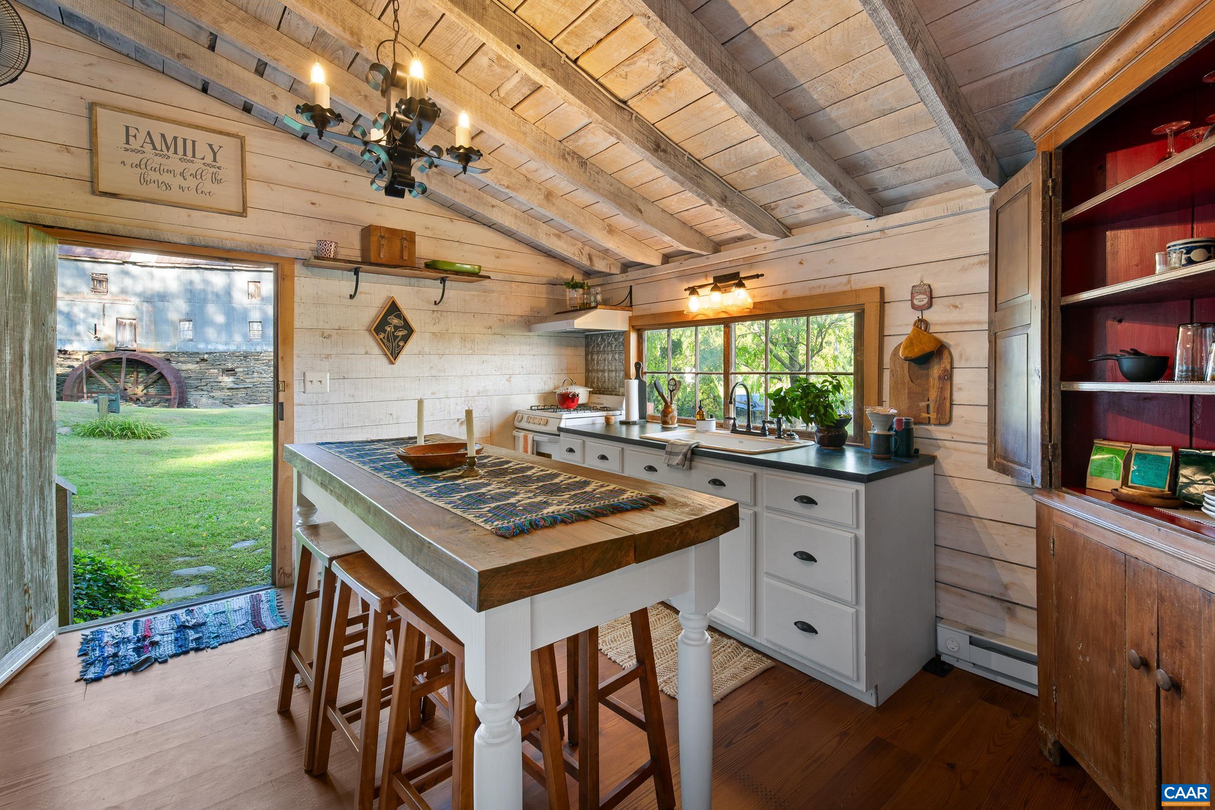4925 Crabtree Falls Highway Tyro, VA 22976 - Photo 27 of 48 a kitchen with stainless steel appliances granite countertop a stove and a view of living room