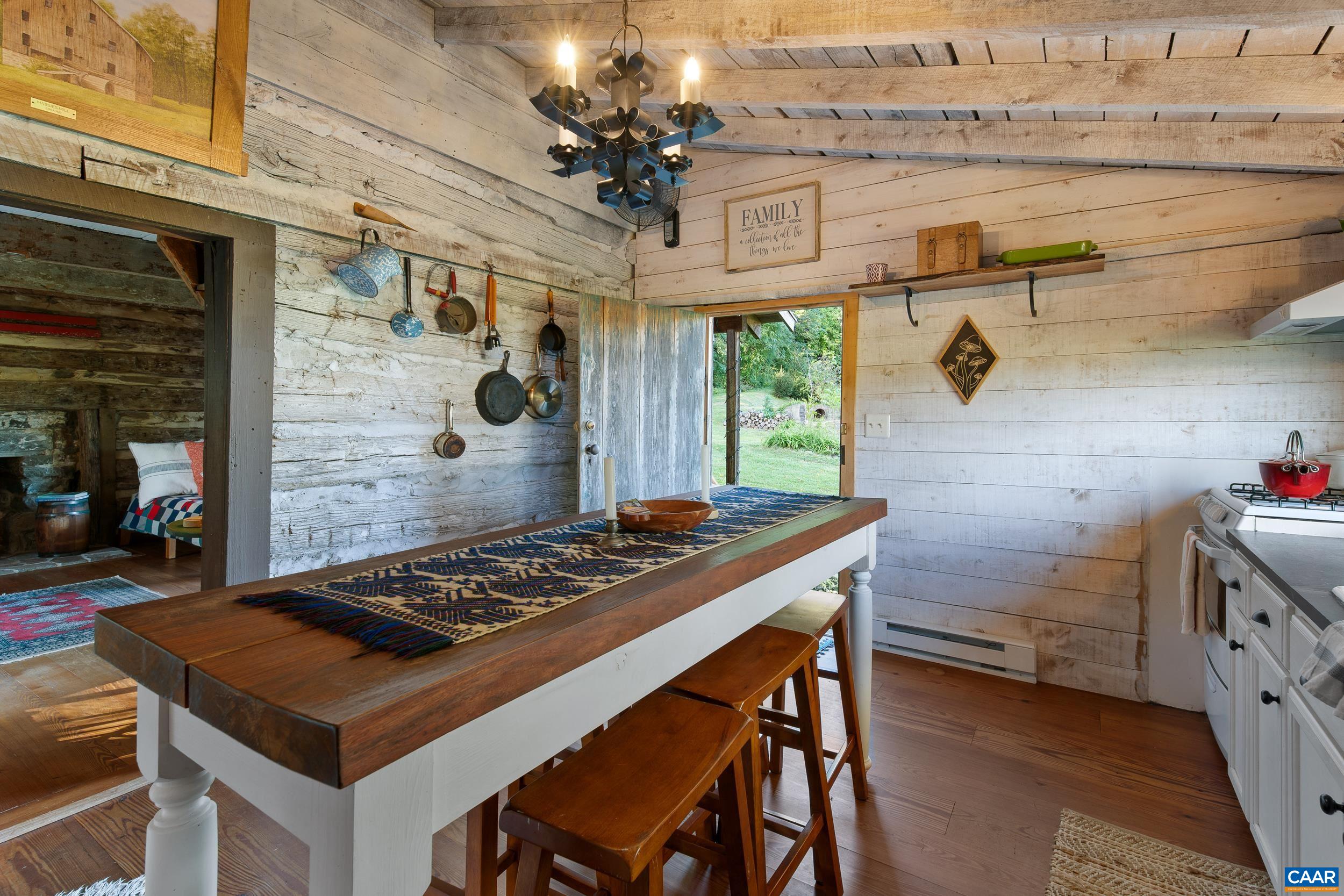 4925 Crabtree Falls Highway Tyro, VA 22976 - Photo 28 of 48 a kitchen with a stove and a table