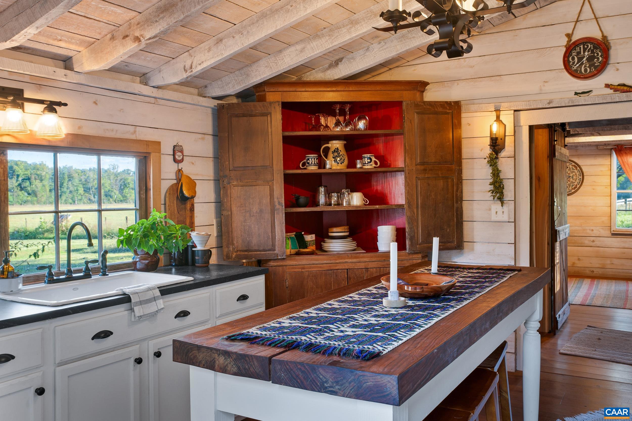 4925 Crabtree Falls Highway Tyro, VA 22976 - Photo 33 of 48 a kitchen with stainless steel appliances granite countertop a stove and a sink