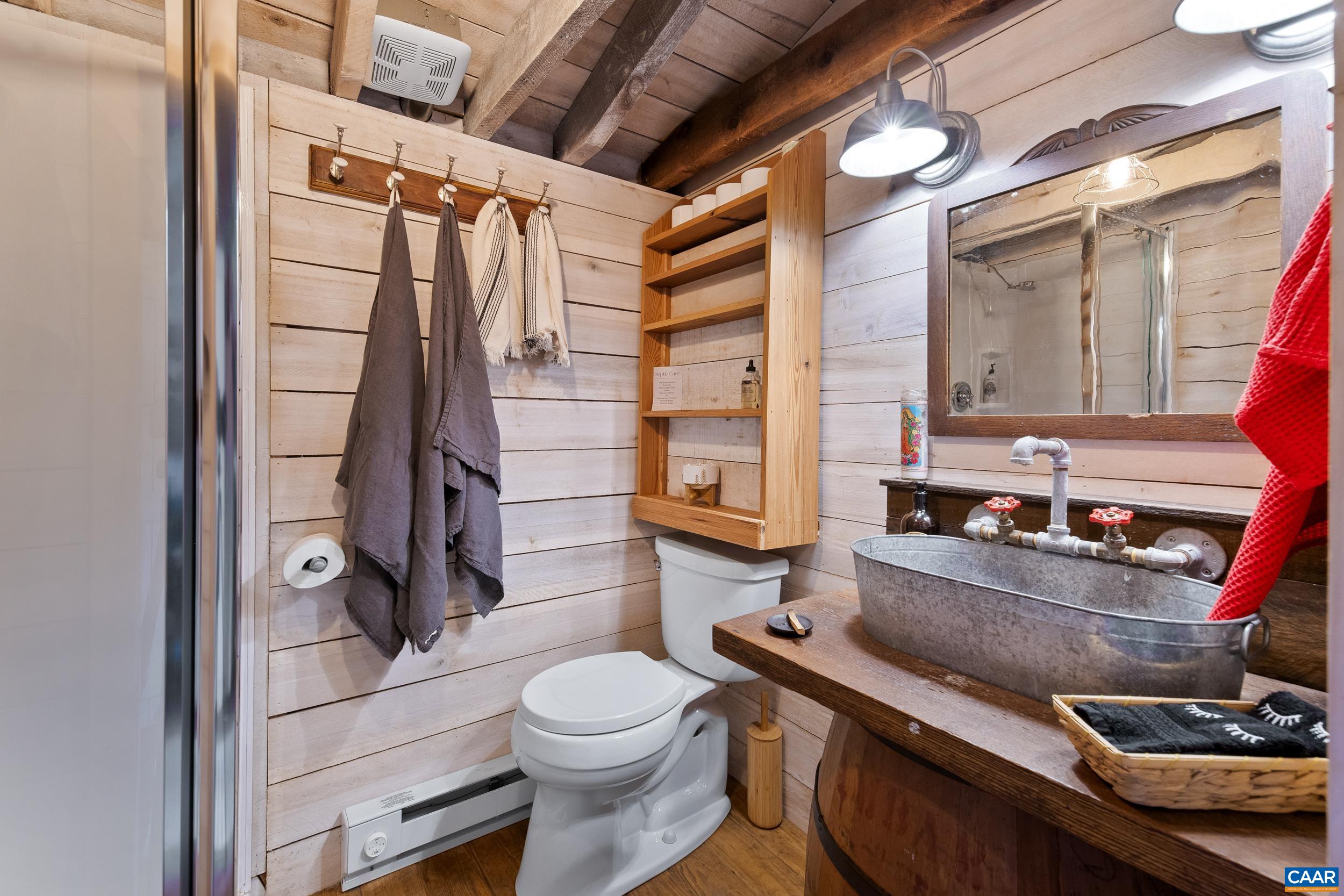 4925 Crabtree Falls Highway Tyro, VA 22976 - Photo 45 of 48 a bathroom with a sink toilet and shower