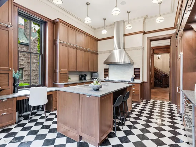 a kitchen with a stove sink and microwave
