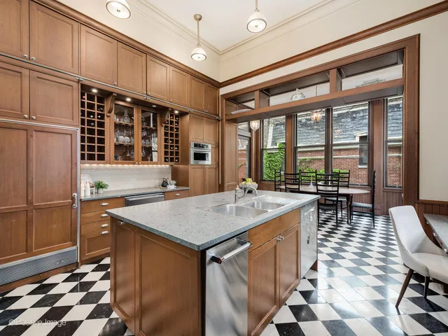 a spacious bedroom with a bed and a fireplace
