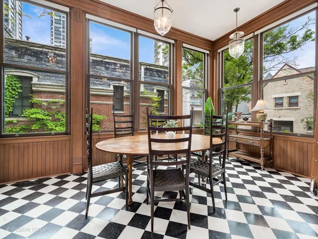 a spacious bedroom with a balcony a bed and a fireplace