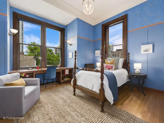 a kitchen with granite countertop a table chairs stove and cabinets
