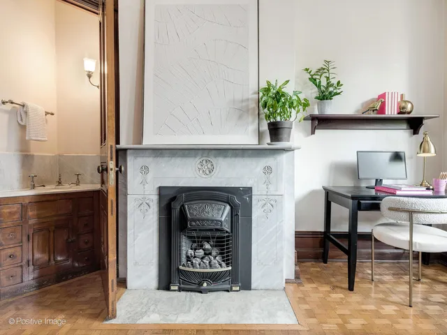 a kitchen with a table chairs and white cabinets