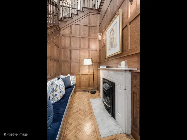 a roof deck with couches and wooden floor