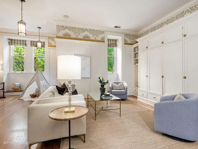 a bedroom with a large bed and a large window