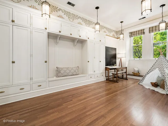 a living room with furniture kitchen view and a table