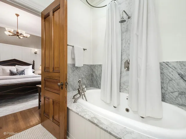 a view of a patio with table and chairs and potted plants