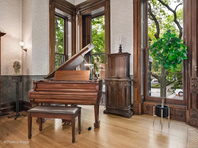 a kitchen with stainless steel appliances a sink a stove a refrigerator and a center island