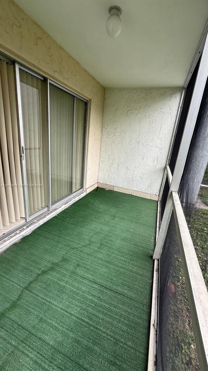 3774 Inverrary Boulevard, Unit 105P Lauderhill, FL 33319 - Photo 11 of 13 a view of a backyard of the house