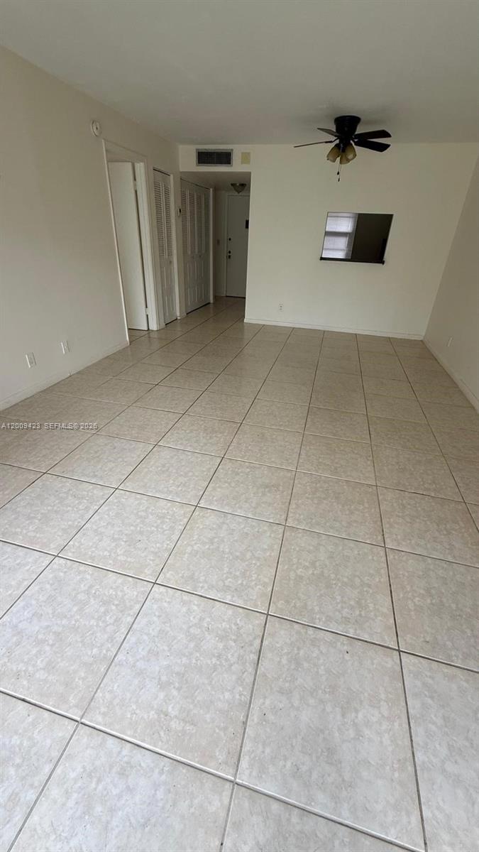 3774 Inverrary Boulevard, Unit 105P Lauderhill, FL 33319 - Photo 2 of 13 a view of empty room with a fireplace and cabinet